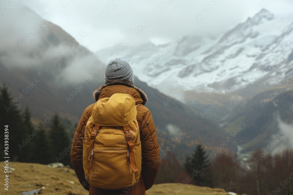 Unrecognizable person traveler, standing near the mountain