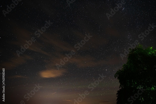 Long time exposure night landscape with Milky Way galaxy on the sky during the Meteor Shower Perseids. Shooting star. Astrophotography