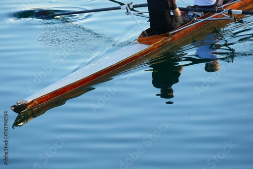 Rowers in a boat with oars on the lake