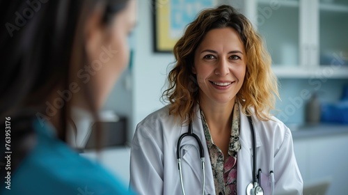 A female doctor engages in a compassionate consultation with a patient in a hospital, emphasizing the importance of their medical care.