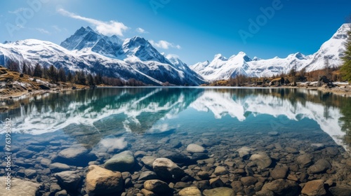 Snowcapped mountains and crystalclear lake in nature