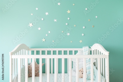 white crib against a pastel blue wall with star decals photo