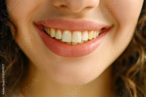 Beautiful cute smile with very clean perfect teeth. Chin, nose and mouth visible. Dental service advertisement