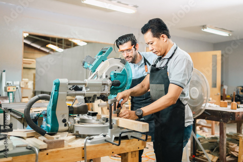 In a carpenter's shop, a skilled man with training in the craft uses tools to perform woodwork, blending occupation, industry, and business.