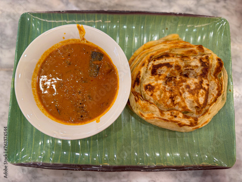 roti cane served with curry soup