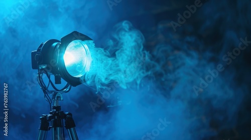 Cinema spotlight with smoke blue neon light, professional cinema light, cinema and entertainment concept.
