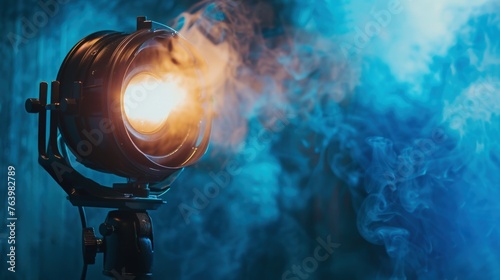 Cinema spotlight with smoke blue neon light, professional cinema light, cinema and entertainment concept. photo