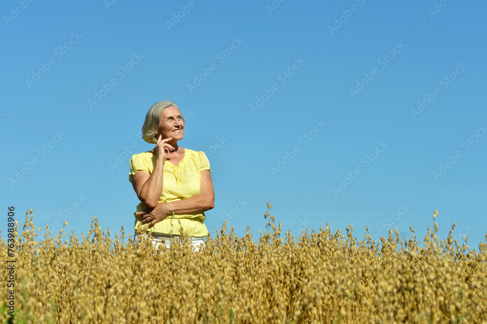 Portrait of senior woman in summer field Portrait of senior woman in summer field