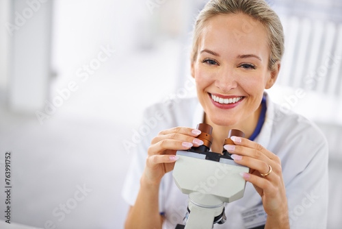 Happy woman, portrait and research scientist with microscope exam, test or scientific discovery at laboratory. Face of female person or medical expert with smile or scope for breakthrough in biology