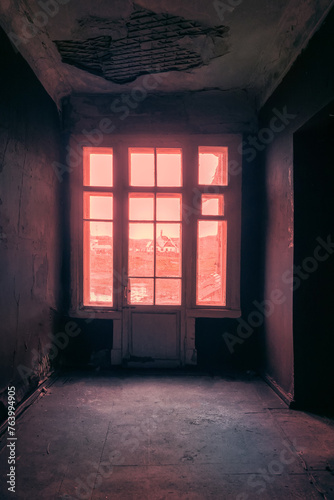 The seaside house has long been abandoned. Window overlooks to sea of Arctic Ocean