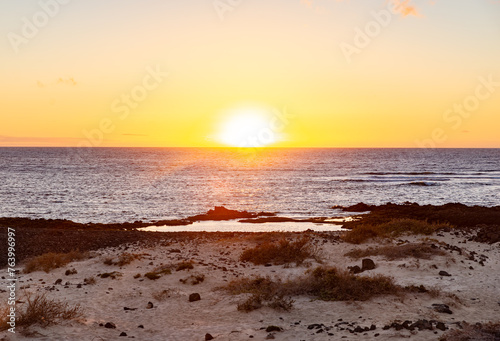 Scenic View of Sealandscape at Sunset Time with Sun in the Horizon Line.Copy Space.Background