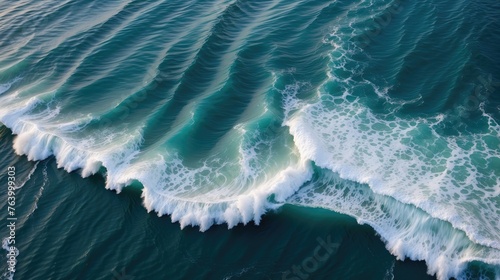 Rhythmic Waves and Seafoam Patterns: An Aerial View of Ocean's Serene Majesty
