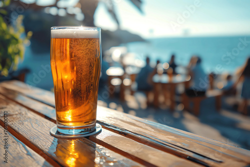 glass of beer on wooden table  sea