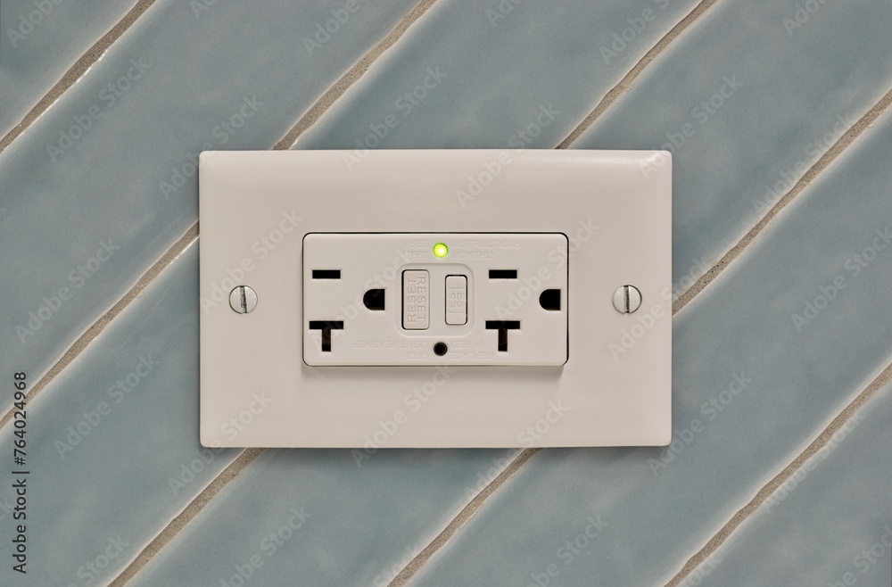 Twin power outlet duplex socket on a tiled wall, USA NEMA 5-15 ...
