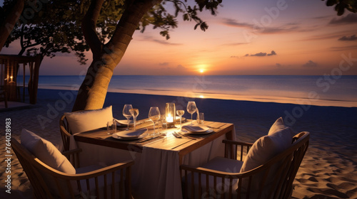Cafe on the seaside, served table and two chairs on the seashore, romantic evening.