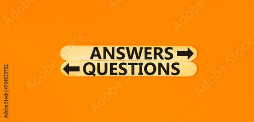 Questions and answers symbol. Concept word Questions Answers on beautiful wooden stick. Beautiful orange table orange background. Business questions and answers concept. Copy space.
