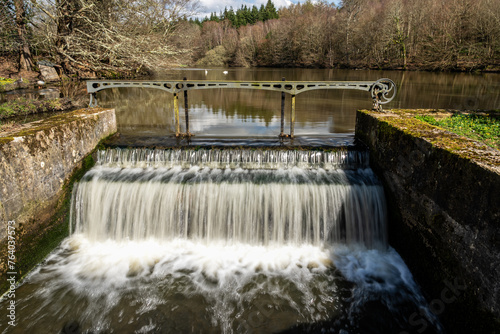 water flowing over the wier photo