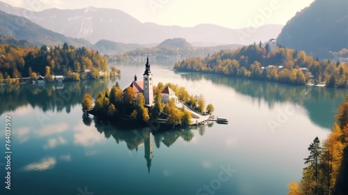 Banner of lake Bled in Slovenia. Charming autumn panorama landscape of island with church rounded colorful trees in the middle of Bled lake. photo