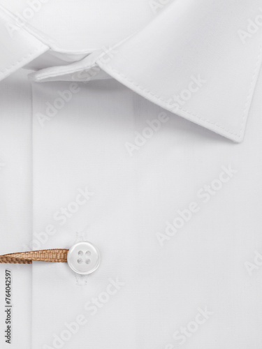 Button placket on a white classic men's shirt, close-up