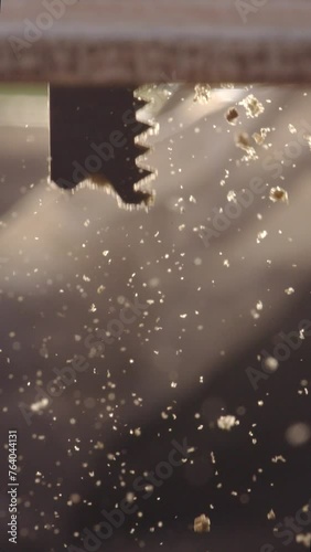 Discover the artistry of woodworking with our captivating slow motion footage capturing the delicate movements of a jigsaw as it skillfully carves through wood. Perfect for showcasing the precision an