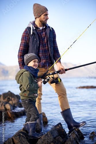 River, father and son with rod for fishing, water and nature for bonding of dad with boy together. Parent, male person and man with kid for adventure in countryside, happiness and smile of child