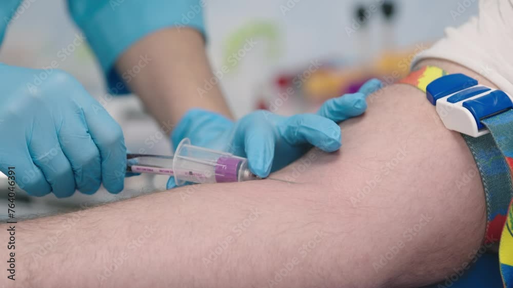 Close up shot of healthcare worker specialist hands in protective gloves making vaccination to patient, nurse hand injecting vaccine into patient arm in hospital lab, vaccination, injection concept Close up shot of healthcare worker specialist hands in protective gloves making vaccination to patient, nurse hand injecting vaccine into patient arm in hospital lab, vaccination, injection concept