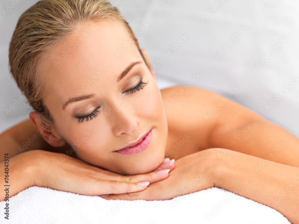 Woman, massage and spa for peace and treatment, destress and wellness with physical therapy at luxury resort. Serene, zen and calm with stress relief, self care with service and holistic healing