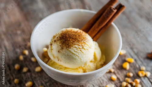 ice cream in a white bowl with cinnamon sticks and corn.
