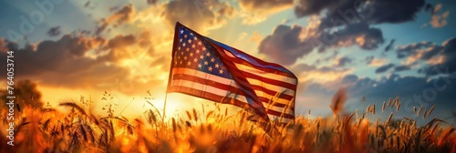 USA flag waving in golden wheat field - The American flag proudly flutters in the sunlit golden wheat field at sunset