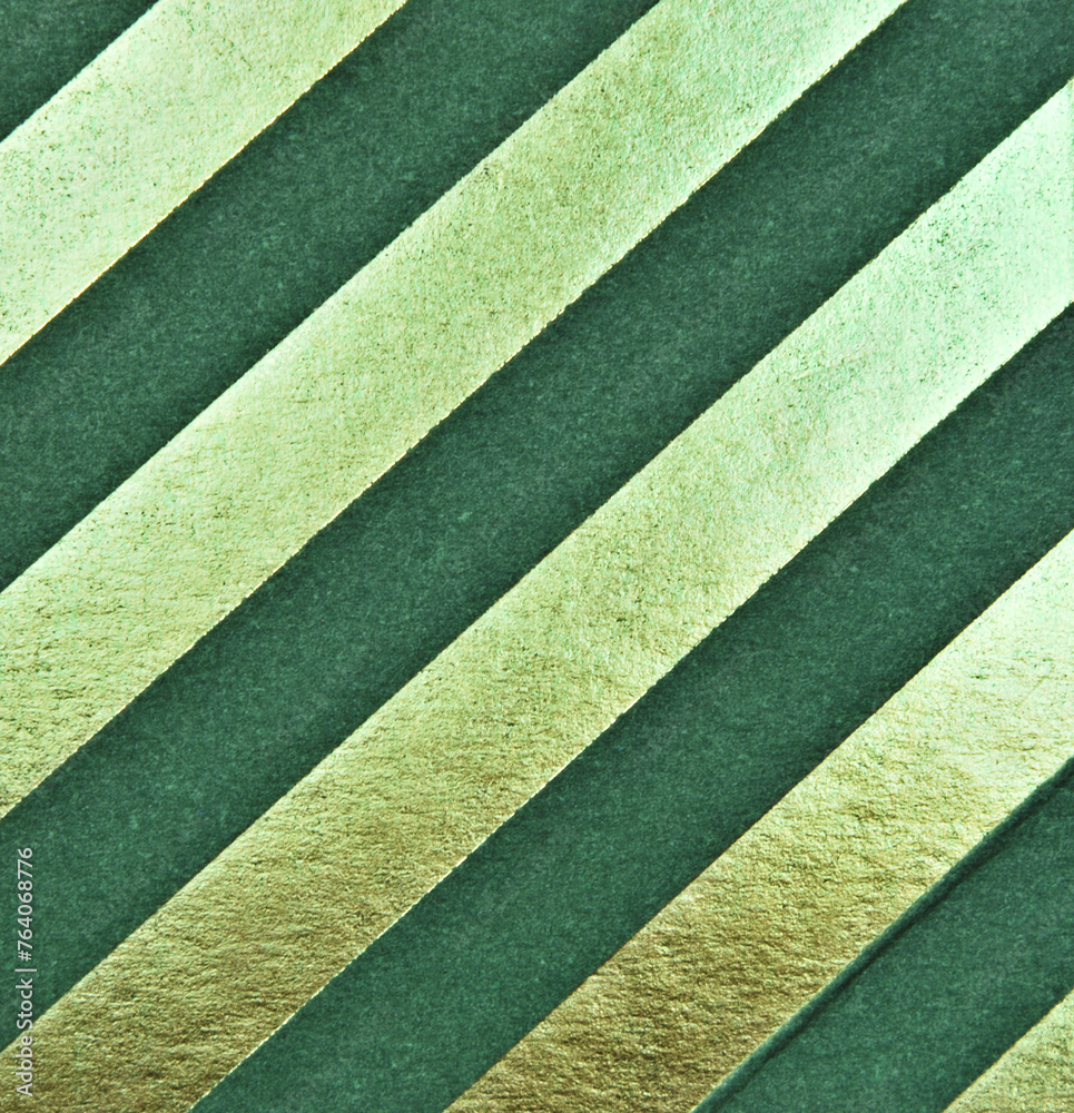 Dark green and golden diagonal stripes cardboard texture as background Dark green and golden diagonal stripes cardboard texture as background