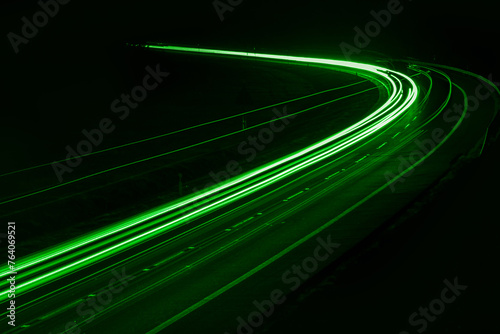 green car lights at night. long exposure