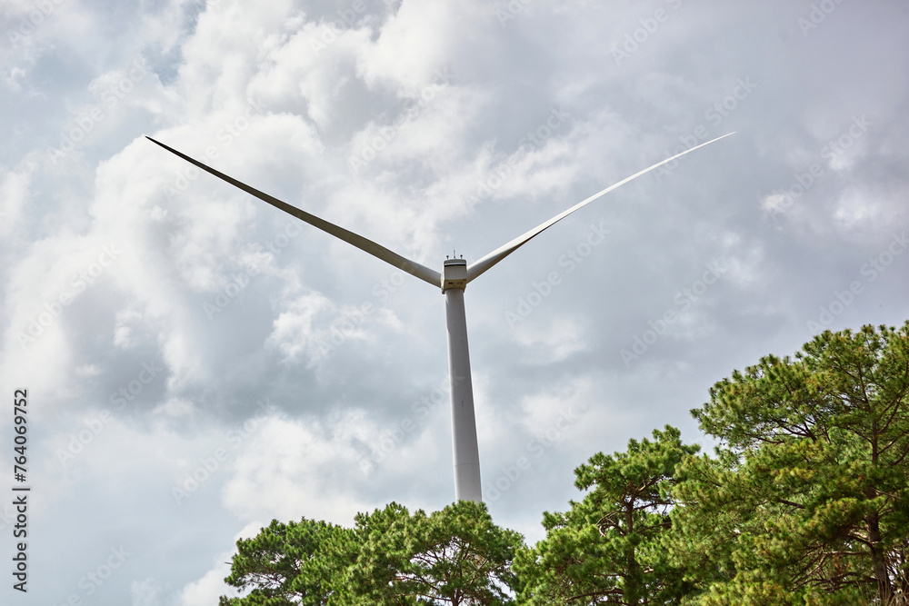 Fototapeta premium Windmills for electric power production against sky