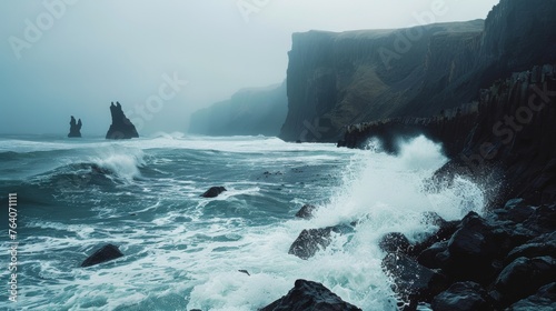 Misty sea cliffs and rocky shore with waves