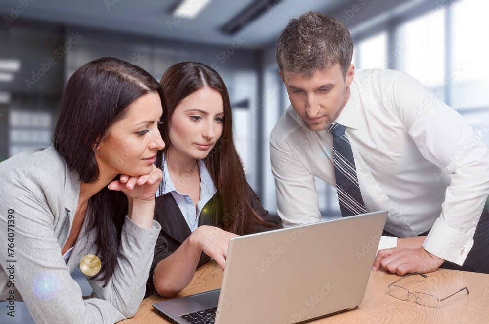 Business people working together at the office Business people working together at the office