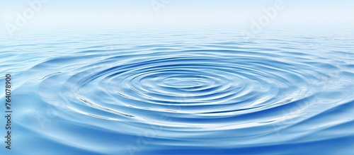 An up-close view of a round ripple expanding on the surface of the water