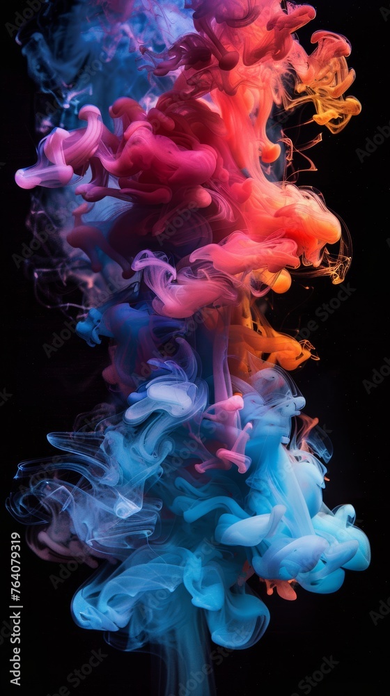 Colorful smoke plumes on dark background