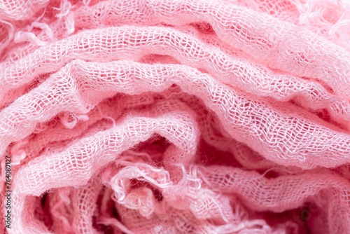 Pink cloth roll,Macro close range,Pile of folded pink blankets. Rolls of pink plaids lie on a shelf, texture effect.