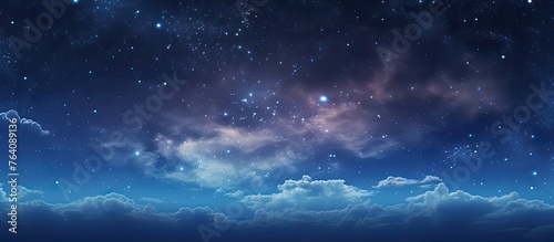 A serene night scene displaying a dark sky filled with twinkling stars and fluffy clouds