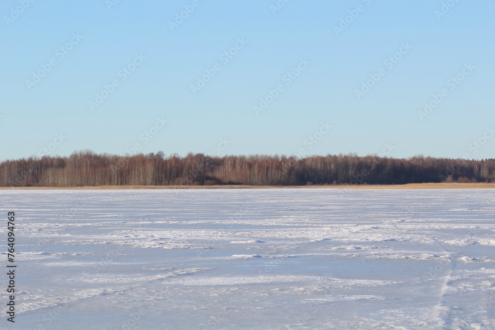 landscape of frozen river and forest landscape of frozen river and forest