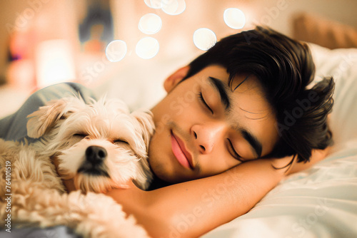 A peaceful image of a young man sleeping soundly with his adorable dog snuggled up close in a cozy bedroom setting. photo