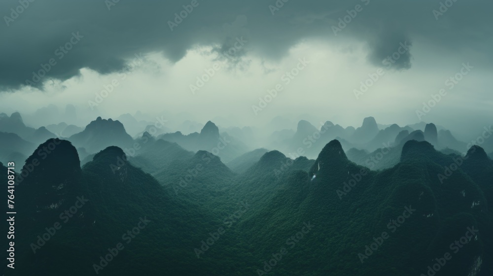 Impressive view of storm clouds over majestic mountains, creating a dramatic scene