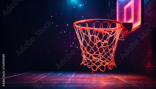 A basketball hoop with sparkling light against dark background © Mystery