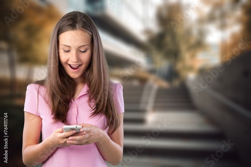 Happy young woman hold mobile phone