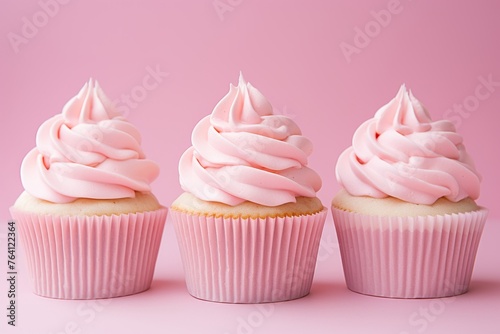 Assorted delicious cupcakes on pastel colored background, tasty treats for celebrations and events