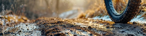 Gritty tires grip the trail, a close-up on mountain biking action, companion ahead photo