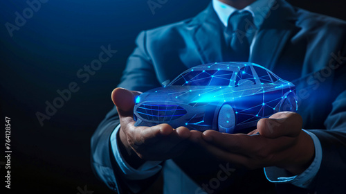 Businessman holding blue digital car icon on black background photo