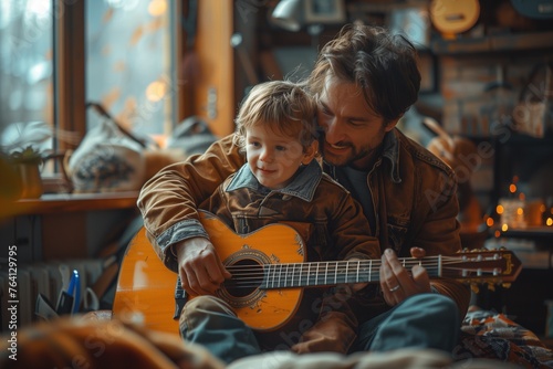 Father teaching boy to play on guitar