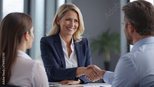 business woman manager handshaking at office meeting. Smiling female hr hiring recruit at job interview