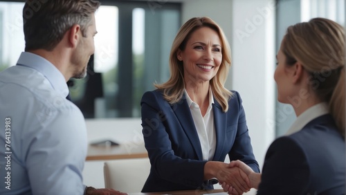 business woman manager handshaking at office meeting. Smiling female hr hiring recruit at job interview photo