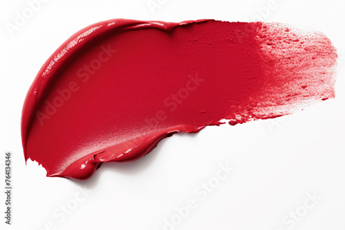 Red lipstick color swatch smudge on white background